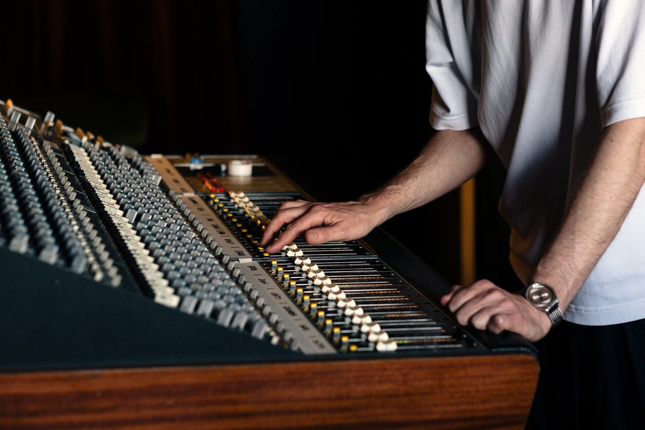Hand on fader detail